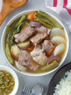  Sinigang na Baboy: Een zure en hartige symbiose die je smaakpapillen zal verrassen!